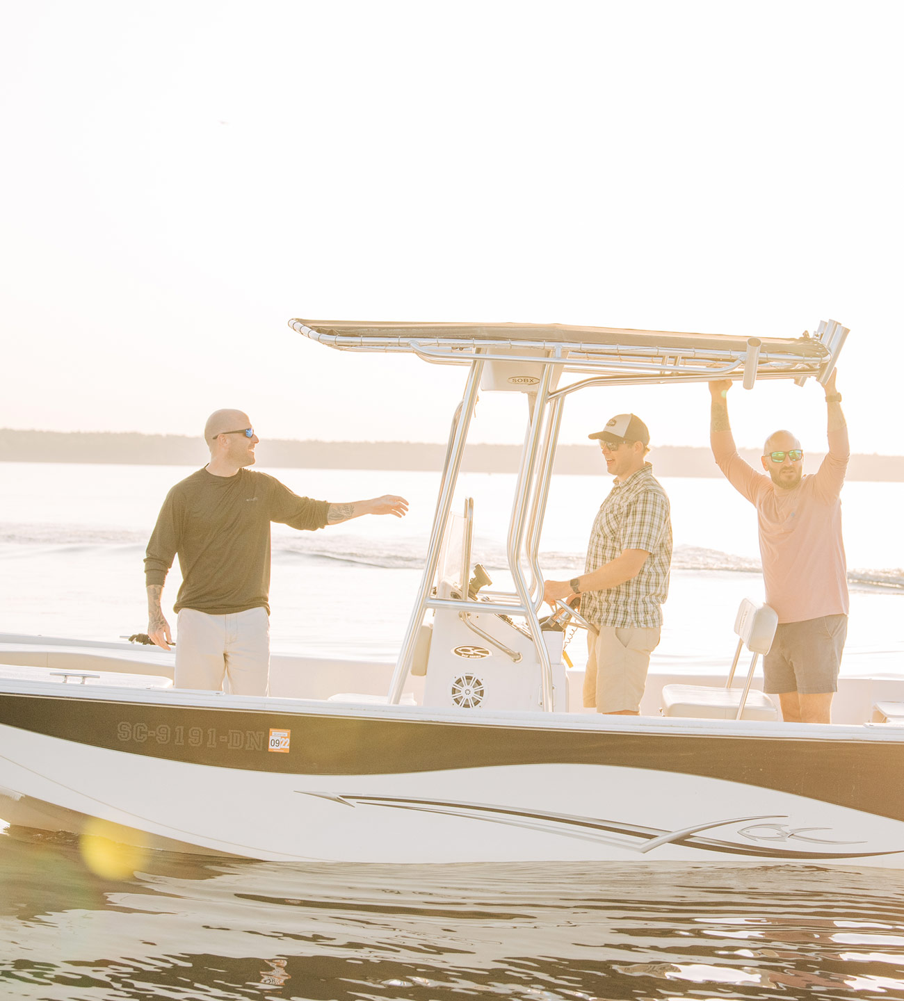 three men in a boat in Lake Marion