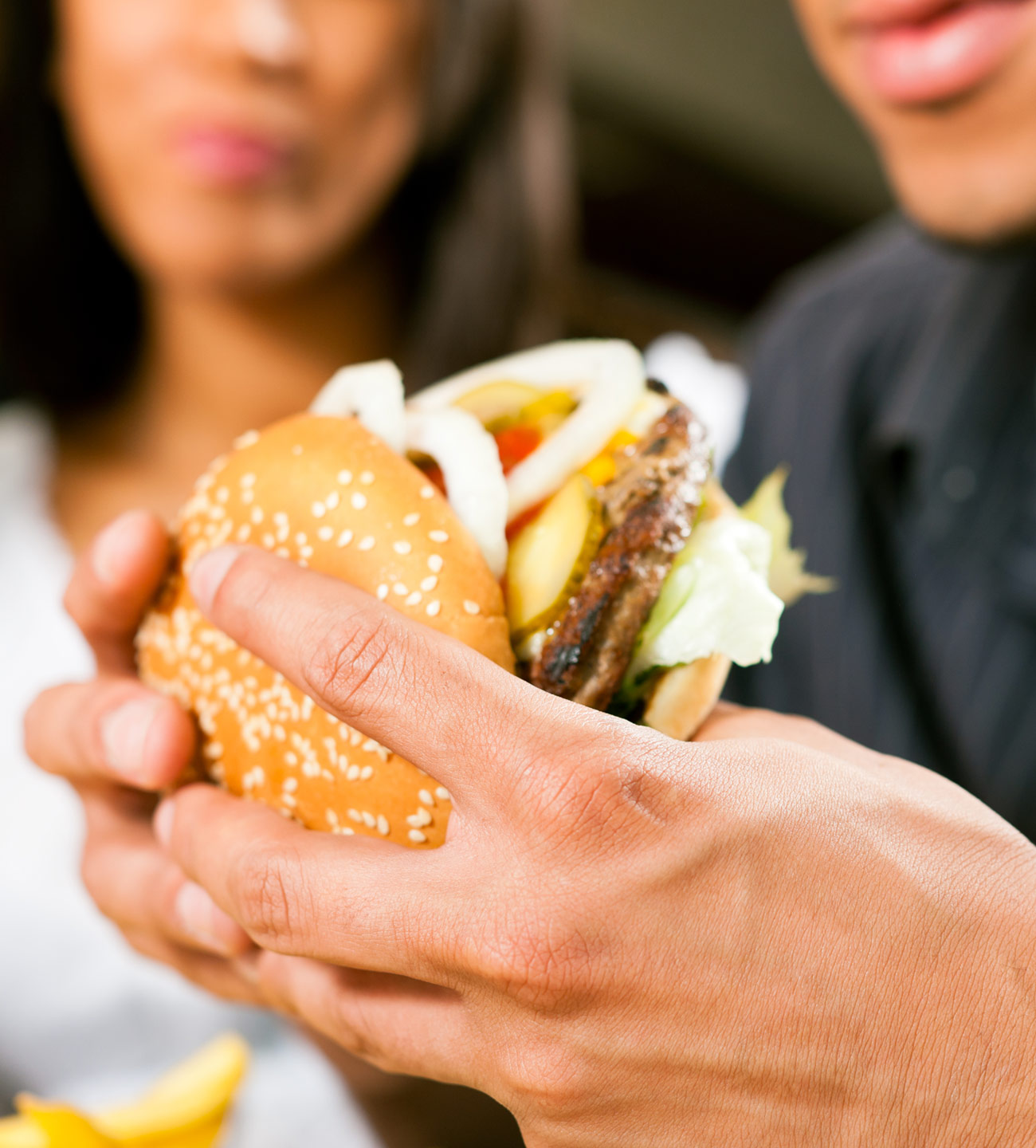 man holding hamburger