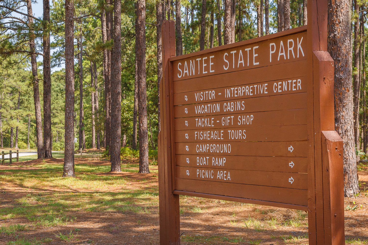 Santee State Park directional sign in woods with direction to campgrounds