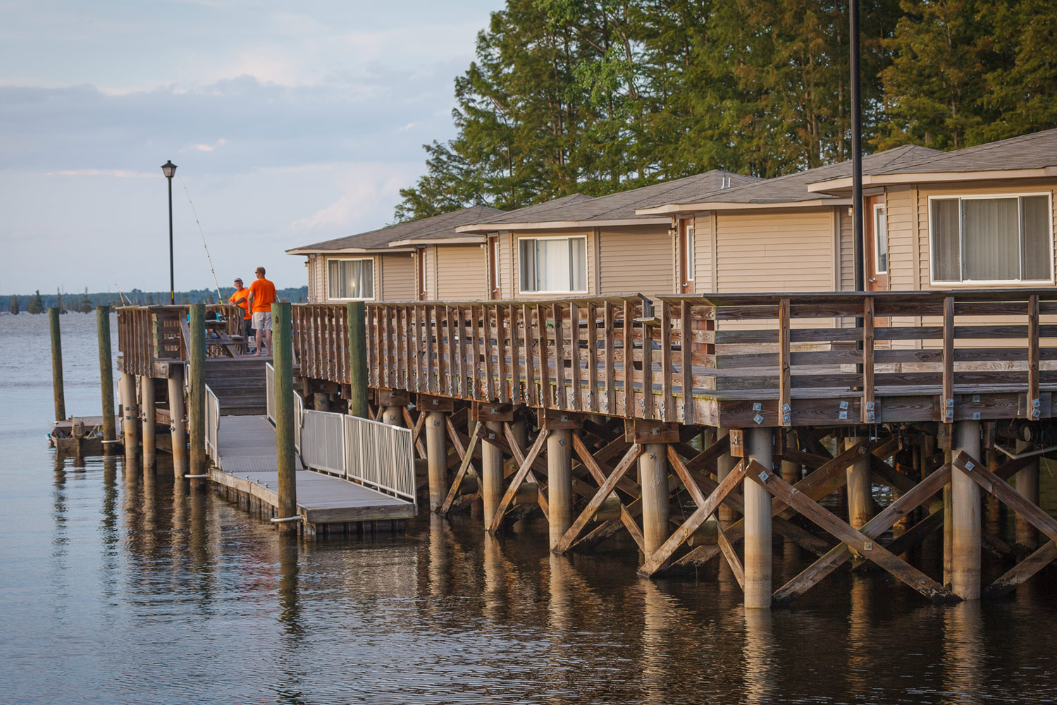 cabins overlooking water with a dock
